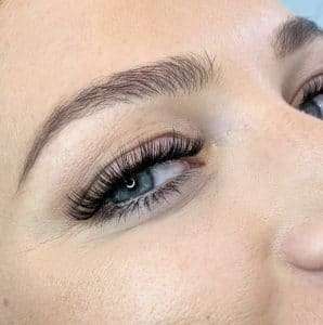 Finished lash extensions enhancing eye shape with a clean, polished look.