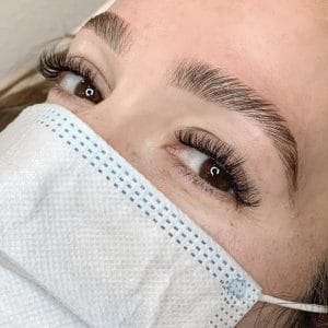Natural-looking eyelash extension results enhancing lash length and volume.